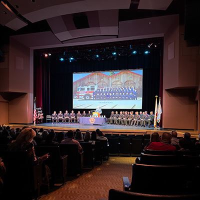 firefighters on stage at the start of the 2026 badge ceremony