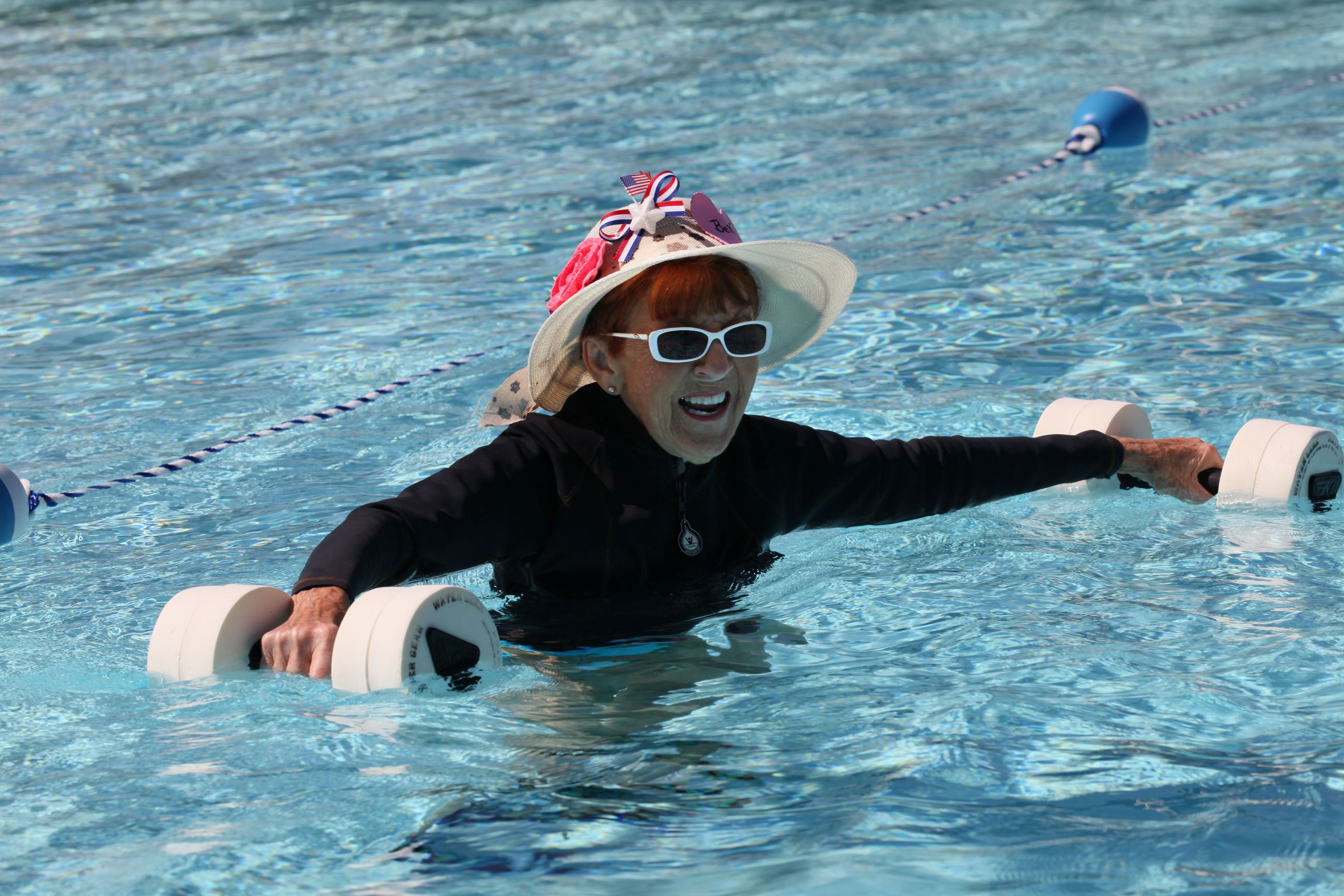 Woman in pool for water aerobics class