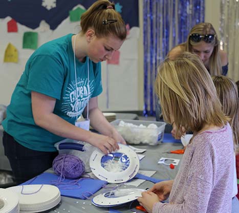 girl holding snowballs at Winter Festival