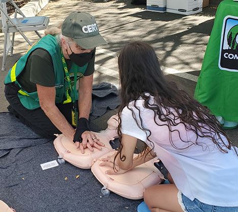 CERT member demonstrating hands only CPR