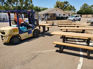 Public Works getting picnic tables ready for delivery